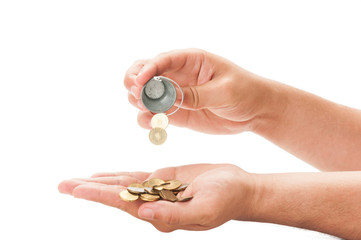 Fototapeta premium Pouring a bucket of coins.