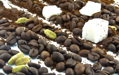 coffee beans, 	   cardamom,	   lump sugar and ground coffee