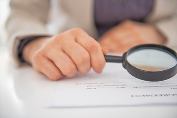 Closeup on business woman exploring document