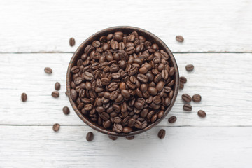 Coffee beans in wooden bowl