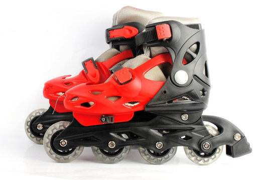 Red & Black Colored roller skates isolated on white