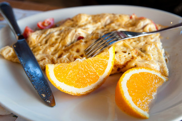 omlete with oranges on a plate