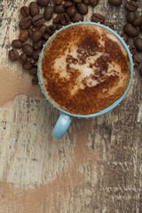 Obraz na płótnie Canvas Coffee cup on a wooden table