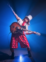 Fototapeta premium Guitarist unusual in shorts