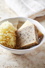 Green Tea Soap and Natural Bath Sponge in a Ceramic Dish