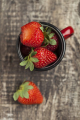 Fresh strawberries ona wooden bowl