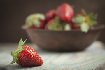 Fresh strawberries ona wooden bowl