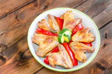 Chicken wings baked with vegetable