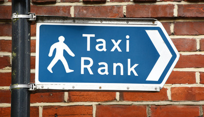Signpost points to a taxi rank