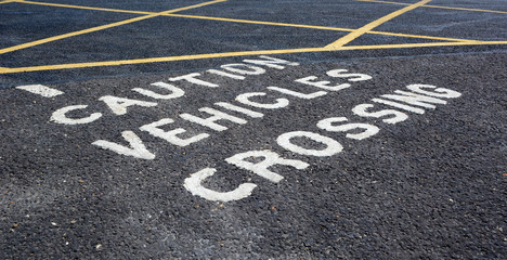 Caution vehicles crossing - warning in car park