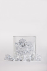 Empty glass filled with ice cubes