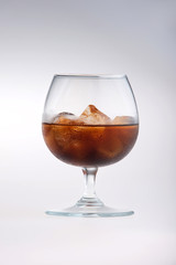 Glass being filled with cola