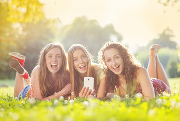 Girls lying on grass