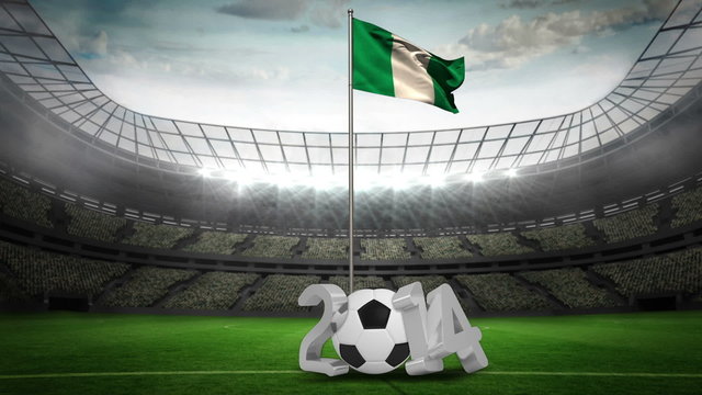 Nigeria national flag waving on flagpole with 2014 message