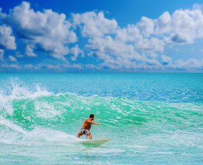 Athletic surfer with board