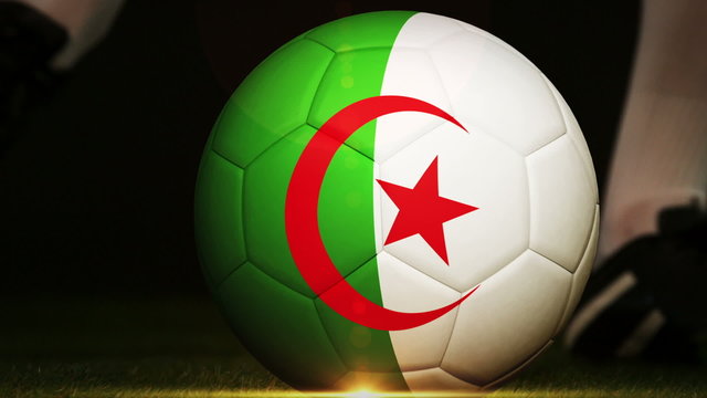 Football player kicking algeria flag ball
