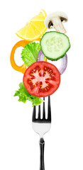 Fresh vegetables on fork