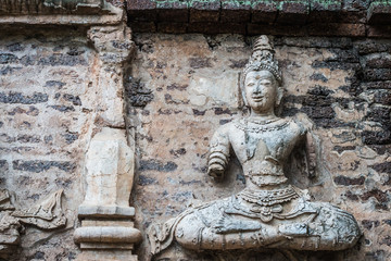 Fototapeta na wymiar Buddha on the wall of the pagoda, Wat Chet Yot, Chiang Mai.