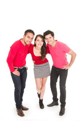 two young men and a young girl dressed in red posing