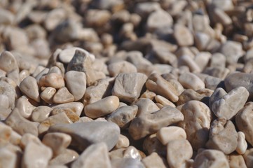 Background of small brown rocks. Shallow DOF