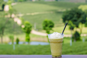 Ice green tea smoothies on tea plantation blackguard