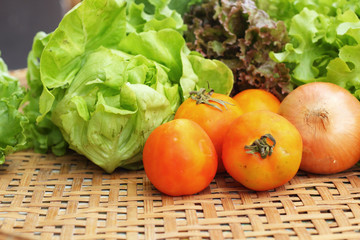 Vegetables salad and tomato in the basket