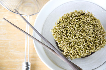 green raw noodles in bowl