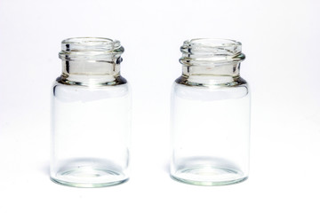 Empty little bottles isolated on white background