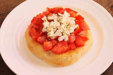 Bruschetta with tomatoes, oregano and feta cheese
