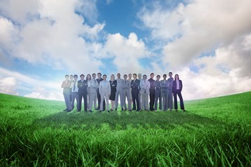 Composite image of business people standing up