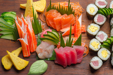 Down top view of sushi platter on a wooden board