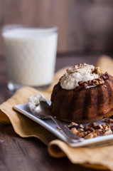 chocolate orange cake with whipped cream and toasted walnuts