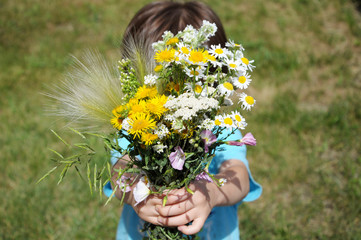 Boy bringning flowers