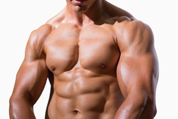 Fototapeta na wymiar Mid section of a shirtless muscular man