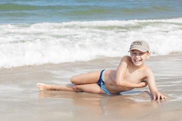 child boy cheerful on beach © izuboky