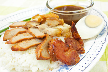BBQ Pork, sausage, crispy pork over rice.