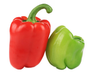 Two red and green sweet bell peppers.