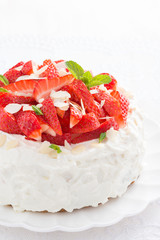 cake with whipped cream and strawberries, vertical