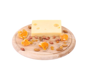 Cheese on board with nuts and orange.