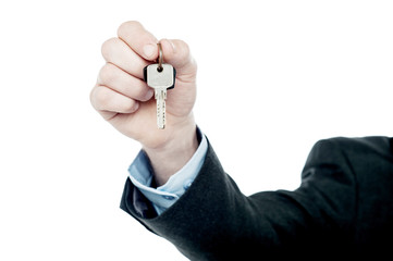 Fototapeta premium Male hand giving your key, isolated on white