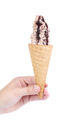 Hand holds ice cream.