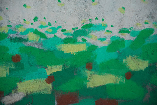 green paint dabs on the wall background