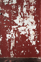 Background peeled brawn scarlet paint on the wall.
