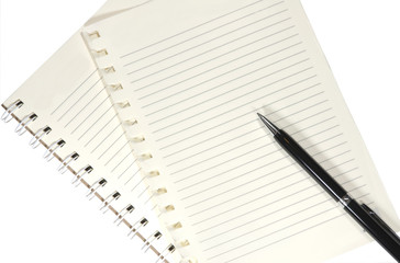 A blank white notebook and pen on white background