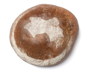 A loaf of fresh bread covered with rye flour in the shape of Gui