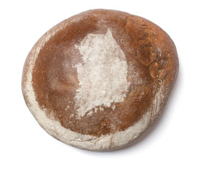 A loaf of fresh bread covered with rye flour in the shape of Sou