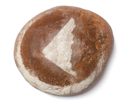 recommend clip art: A loaf of fresh bread covered with rye flour in the shape of Yuk