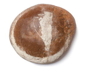 A loaf of fresh bread covered with rye flour in the shape of Gib