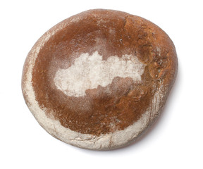 A loaf of fresh bread covered with rye flour in the shape of Slo
