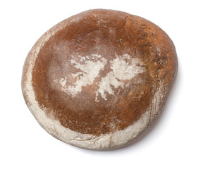 A loaf of fresh bread covered with rye flour in the shape of Fal